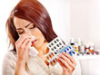 Woman with handkerchief having  tablets and pills.