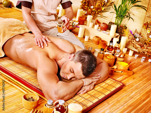 Photo: Woman getting bamboo massage. Woman getting bamboo massage.