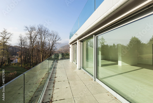 Photo: modern architecture, new empty apartment, balcony view modern architecture, new empty apartment, balcony view
