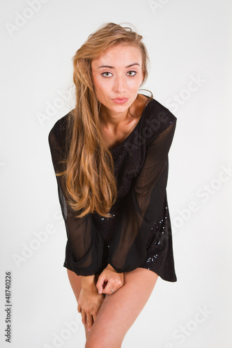 Photo: sexy young woman dancing in studio. sexy young woman dancing in studio.