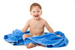 Smiling little boy in towel