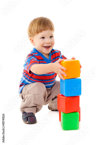 Photo: Little boy playing with cubes Little boy playing with cubes