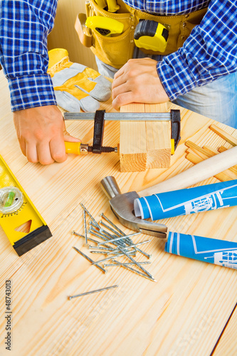 Photo: close up view on a fixing process close up view on a fixing process