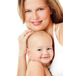 Young mother hugging baby