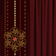 Jewelry background, gold flower pendant on red drapery