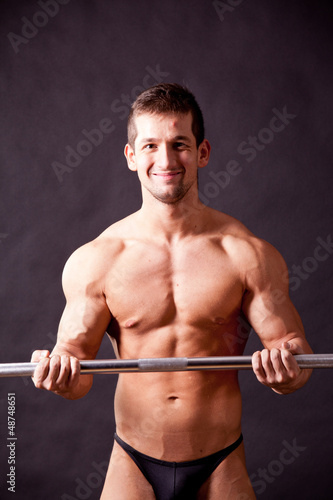 Photo: young bodybuilder traininig young bodybuilder traininig