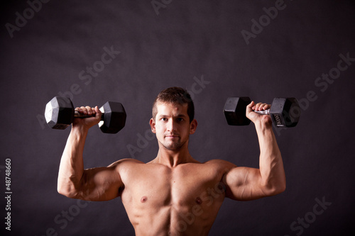 Photo: young bodybuilder traininig young bodybuilder traininig