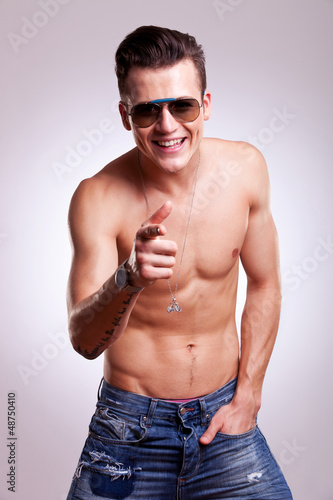 Photo: young topless man pointing at you young topless man pointing at you