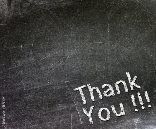 Photo: Thank You handwritten with white chalk on a blackboard. Thank You handwritten with white chalk on a blackboard.