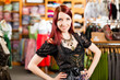 Woman is trying Tracht or dirndl in a shop