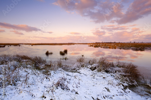 Photo: sunrise over frozen lake sunrise over frozen lake
