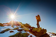 Hiker walking in autumn mountains