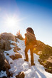 Hiker walking in autumn mountains