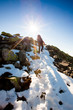 Hiker walking in autumn mountains