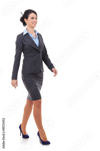 Photo: young business woman is walking young business woman is walking