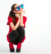 Photo: Young woman in red with heart shaped glasses Young woman in red with heart shaped glasses