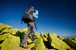Hiker walking in autumn mountains