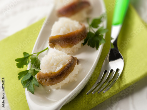 Photo: meatballs with rice and anchovy, selective focus meatballs with rice and anchovy, selective focus
