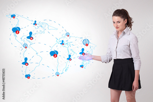 Photo: Young business woman presenting social map Young business woman presenting social map