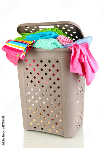 Photo: Beige laundry basket isolated on white Beige laundry basket isolated on white