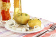 Dish of herring and potatoes on plate isolated on white