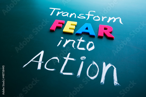 Photo: Transform fear into action concept Transform fear into action concept