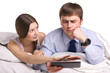 couple with pad in a bed