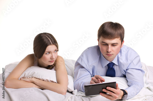 Photo: girl, man and pad in a bedl girl, man and pad in a bedl