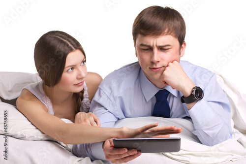Photo: couple with pad in a bed couple with pad in a bed