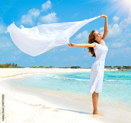 Photo: Beautiful Girl With White Scarf on The Beach Beautiful Girl With White Scarf on The Beach