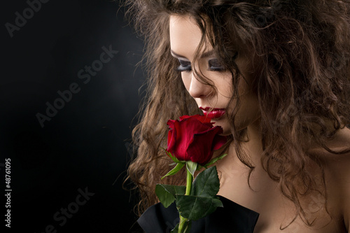 Photo: glamorous young woman with rose glamorous young woman with rose