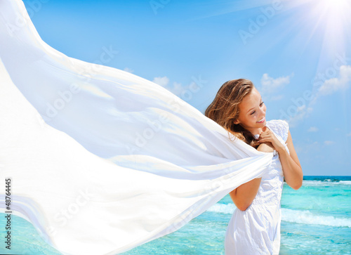 Photo: Beautiful Girl With White Scarf on The Beach Beautiful Girl With White Scarf on The Beach