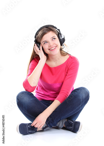 Photo: Woman with headphones listening music. Music teenager girl Woman with headphones listening music. Music teenager girl