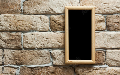 Photo: photo frame on brick wall photo frame on brick wall