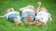 Group of happy children playing outdoors in spring park