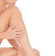 Woman touching her leg