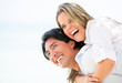 Happy couple laughing outdoors