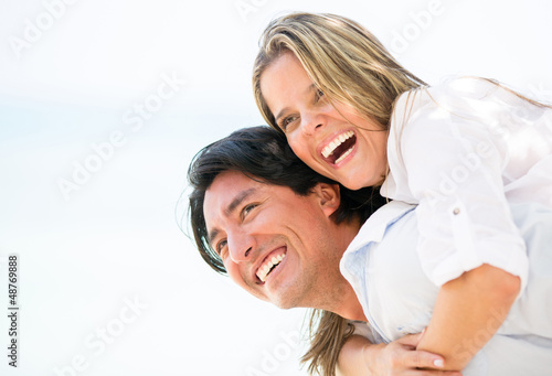 Photo: Happy couple laughing outdoors Happy couple laughing outdoors