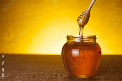 Photo: Honey jar with dipper Honey jar with dipper