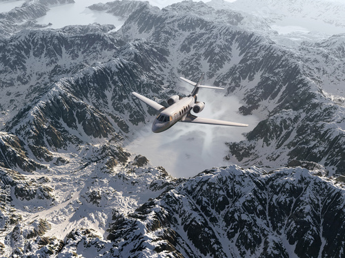 Photo: aircraft flies over a snowy mountain range aircraft flies over a snowy mountain range