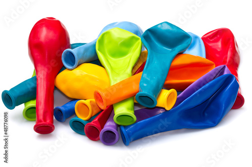 Photo: colorful deflated balloons, isolated on white colorful deflated balloons, isolated on white