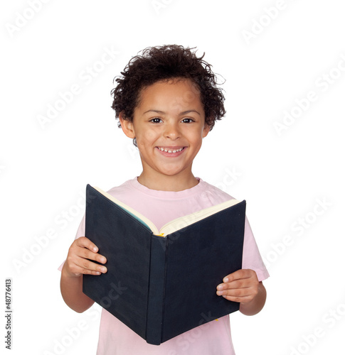 Photo: Happy latin child with a book reading Happy latin child with a book reading