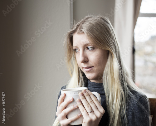 Photo: Young Woman Drinking Coffee Young Woman Drinking Coffee