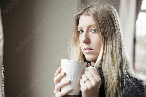 Photo: Young Woman Drinking Coffee Young Woman Drinking Coffee