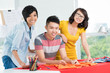 Three smiling Asians