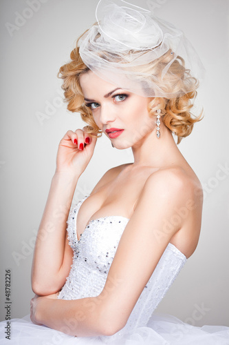 Photo: beautiful bride portrait wearing professional make-up beautiful bride portrait wearing professional make-up