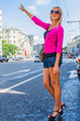 Photo: Photo of a young and beautiful woman who tries to stop a taxi Photo of a young and beautiful woman who tries to stop a taxi