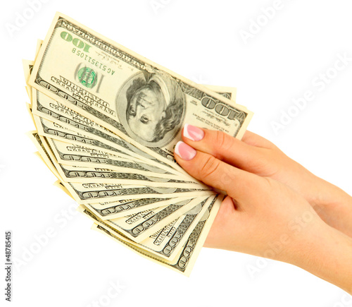 Photo: Female hand with dollars, close up, isolated on white Female hand with dollars, close up, isolated on white