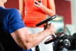 Personal Trainer in gym and dumbbell training