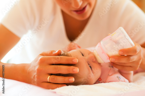 Photo: Mother is feeding the baby Mother is feeding the baby
